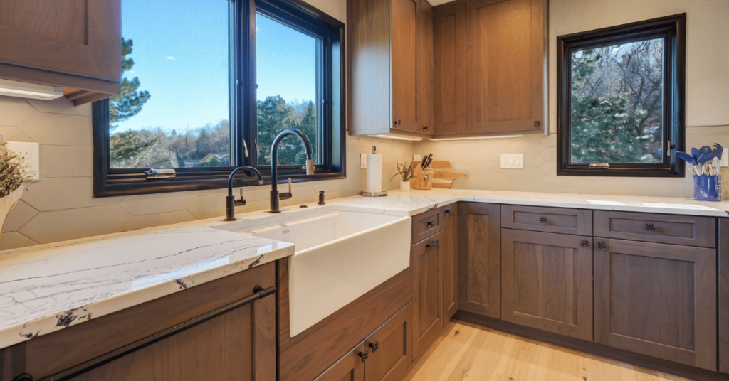 A contemporary kitchen with Black Walnut cabinets in a Putty Stain.